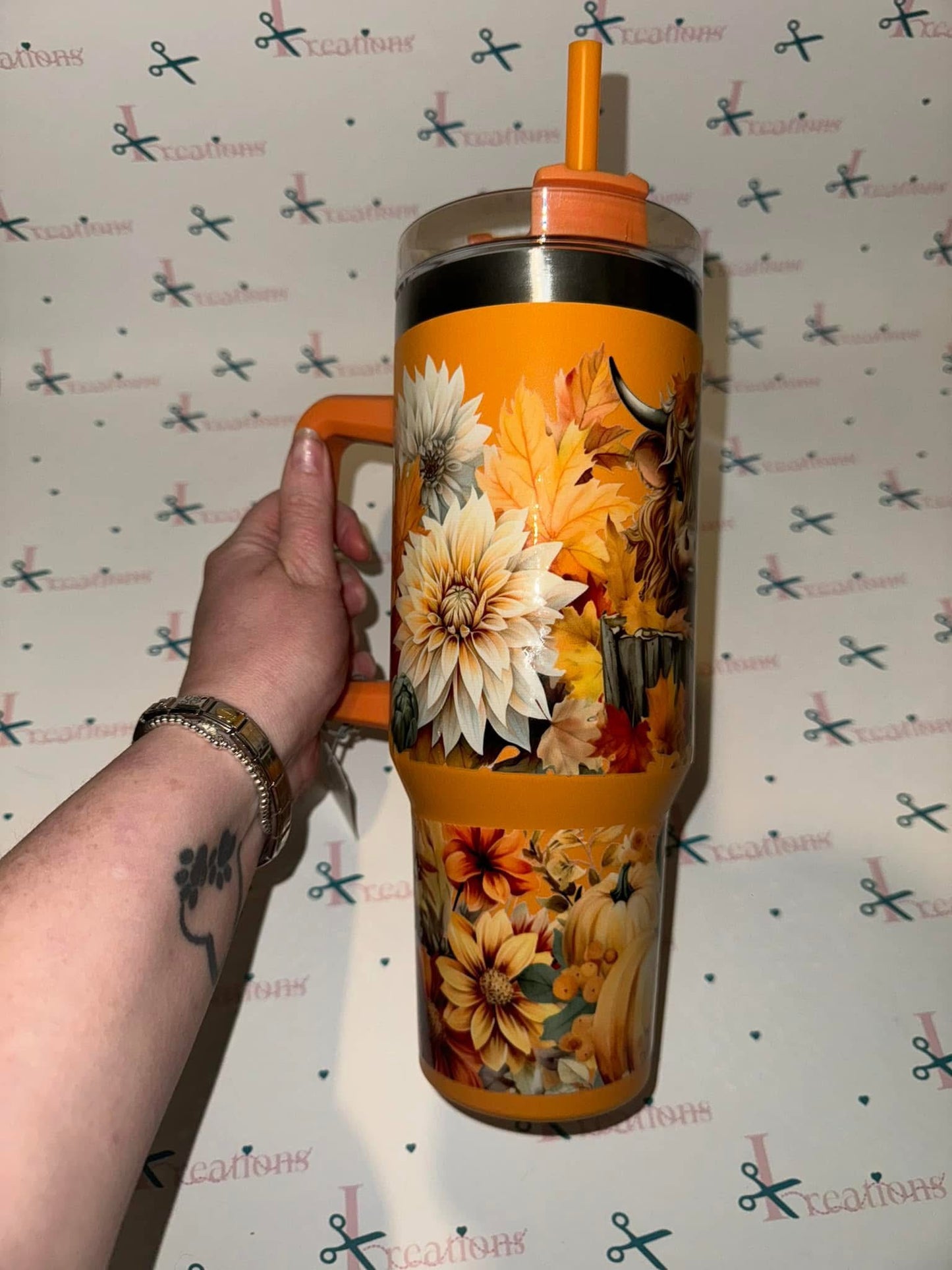 Whoopsie Highland Cow 40oz orange tumbler